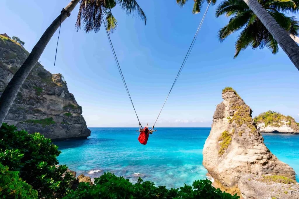 young-woman-tourist-on-bali-swing-at-diamond-beach-bali-1024x683